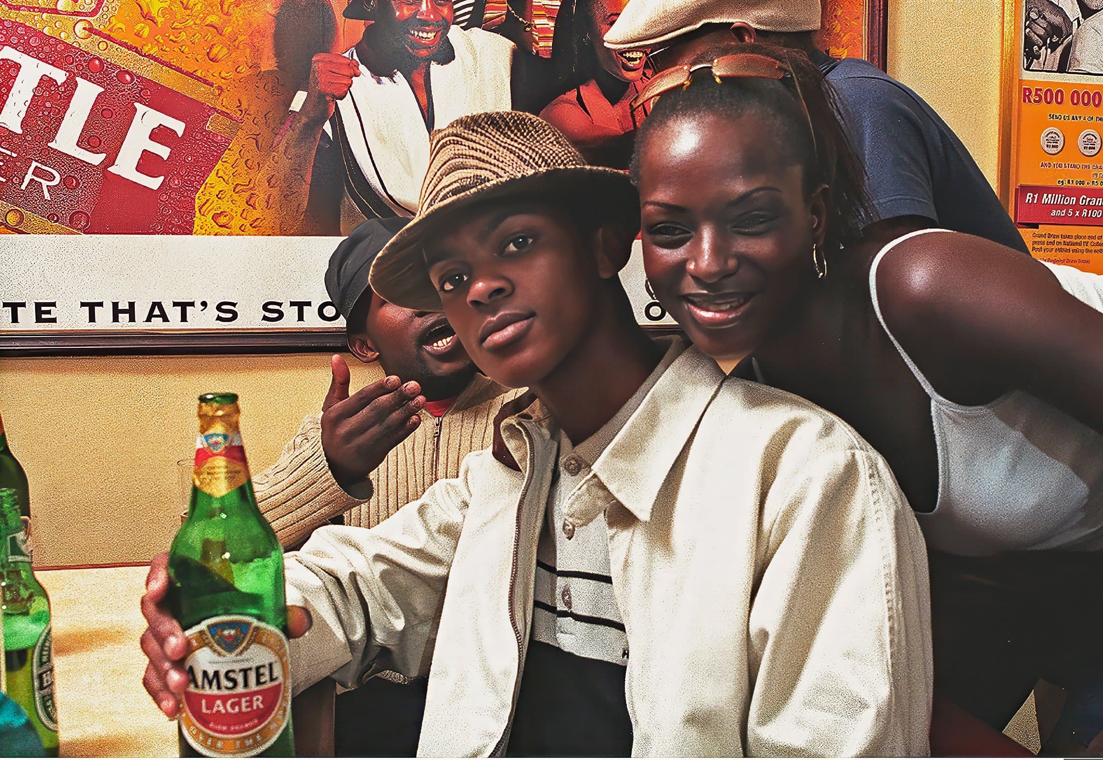 Friends sharing a drink, in colour